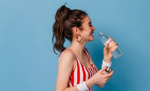Young woman with her hair styled in a messy ponytail