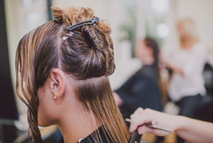 Brunette having her hair cut