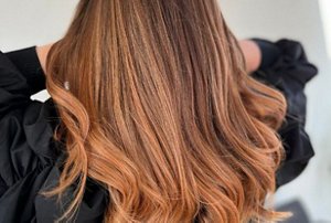 Brunette woman with red highlights