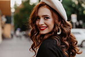 Woman with rich red hair with shiny copper highlights
