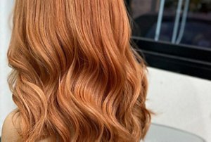 Red hair with lustrous, subtle blonde highlights
