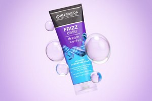 Dream Curls Advanced Hydrating Jelly against a purple background