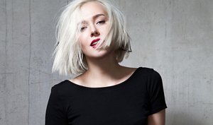 Blonde woman with a blunt-cut chin-length bob with layers