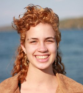 Redheaded woman with a mullet-style haircut