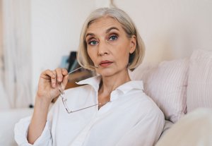 Older woman with a voluminous angled bob talking on her mobile