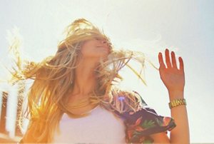 Blonde woman enjoying a sunny day outside