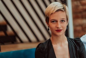 Guest at a black tie wedding with a stylish short haircut