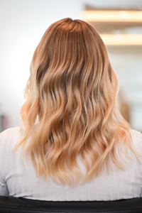 Woman with tousled strawberry bronde hair