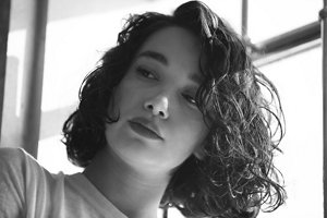 Woman with a textured, tousled French bob haircut