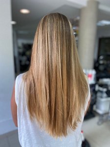 Long, thick hair styled with a V-cut 