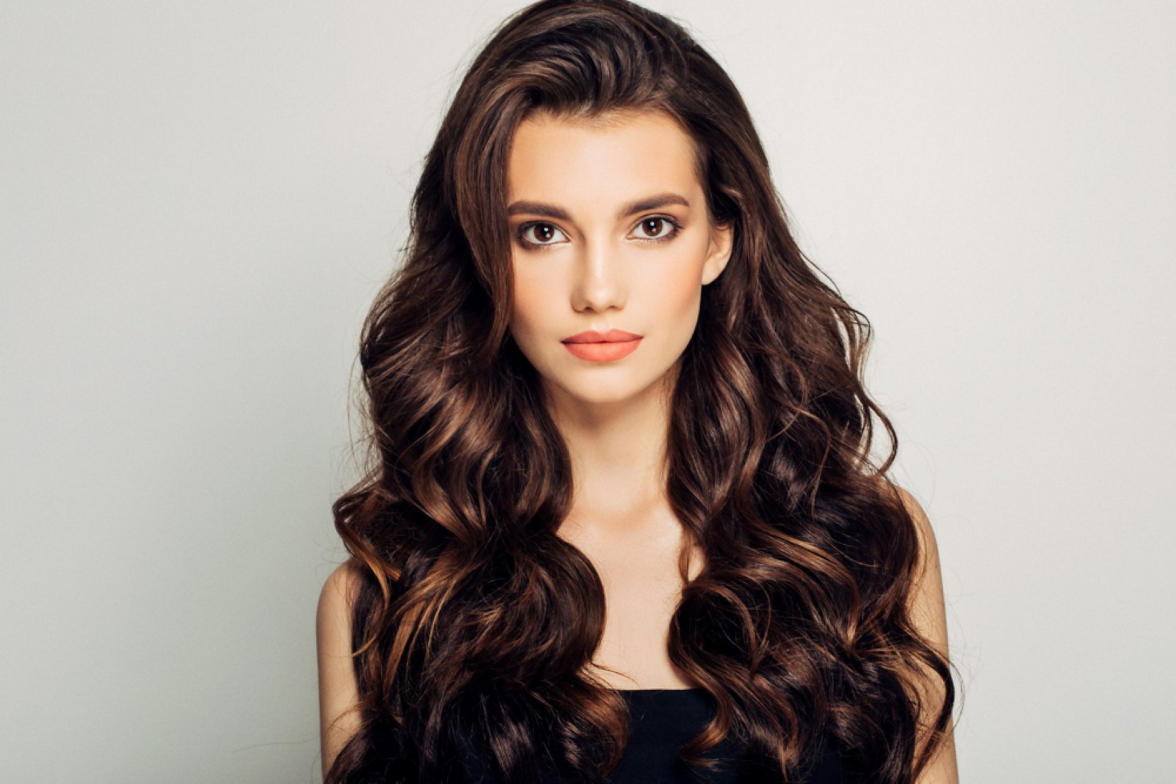 Brunette woman with a bouncy blow-dry