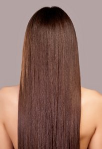 Young woman with long shiny brunette hair