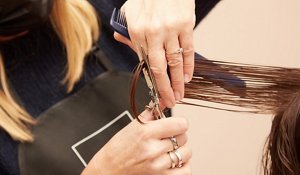 Woman having her hair cut at the hairdressers