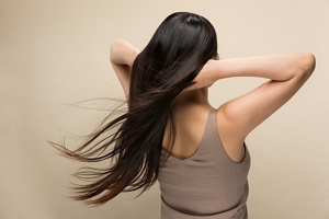 Brunette woman with long, thick, healthy hair