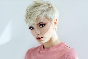 Blonde woman with an expertly-styled tapered pixie cut