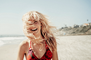Woman on the beach with bleached blonde hair