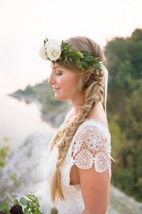Bride with plaited side ponytail and a flower crown