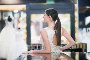 Brunette bride with slicked-back ponytail hairstyle