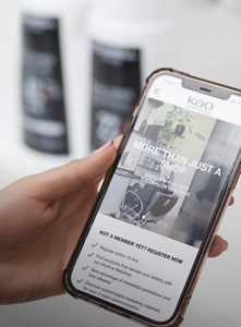 Kao Pro Shop open on a smartphone, held in the hand of a stylist