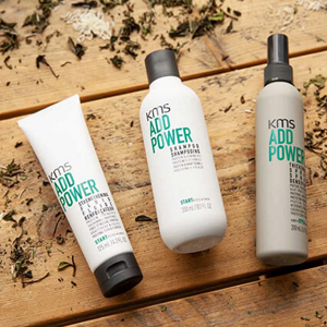 Three KMS Addpower products lying on a wooden background