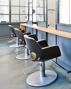 Empty hair salon with chairs and mirrors