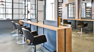 Empty hair salon with chairs and mirrors