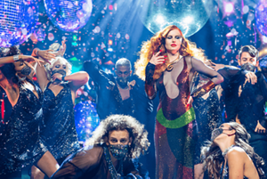 Galashow with models on stage dancing