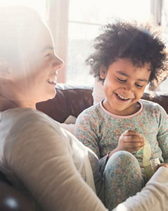 Mom reading a book to her kids