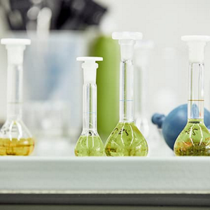 Test tubes filled with green and yellow liquid