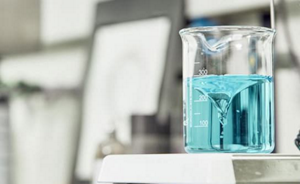 Measuring jug with blue liquid inside