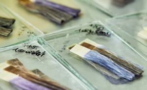 Colored artificial hair strands