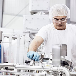 Lab assistant working on machine