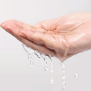 Water in hand palm with grey background