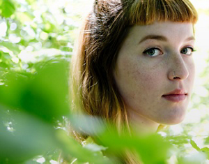 hand holding a plastic case in the laboratory with a green leaf