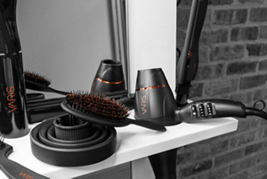 VARIS crimper and other hairstyling products placed in front of a mirror