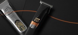 Silver VARIS clipper and black VARIS trimmer in front of a dark background