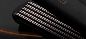 Black VARIS crimper in front of a dark background